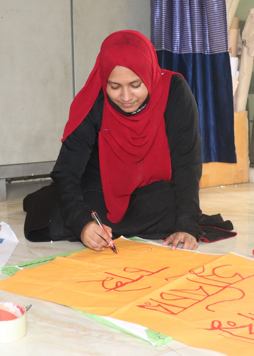 Salina making a poster for a climate change rally in her community. Bishu Chakraborty /ActionAid