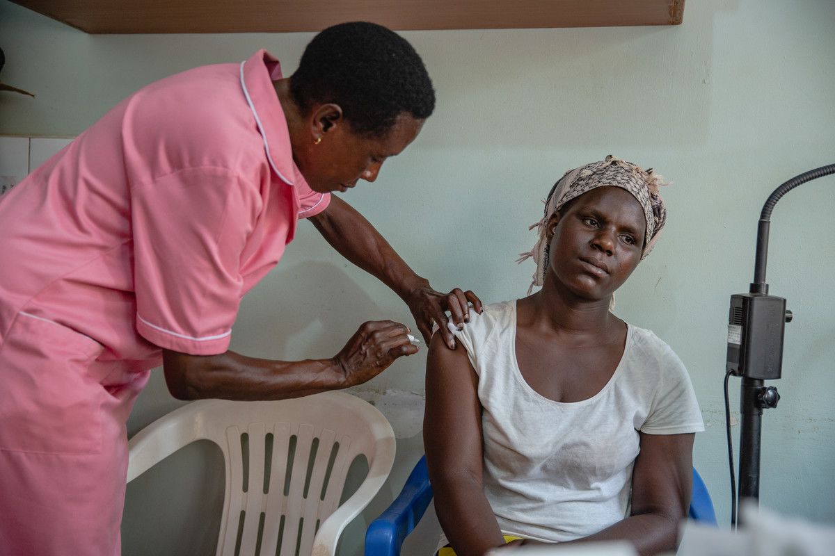 Margaret gives a family planning injection to a client at Kawala Health Center IV in Kampala