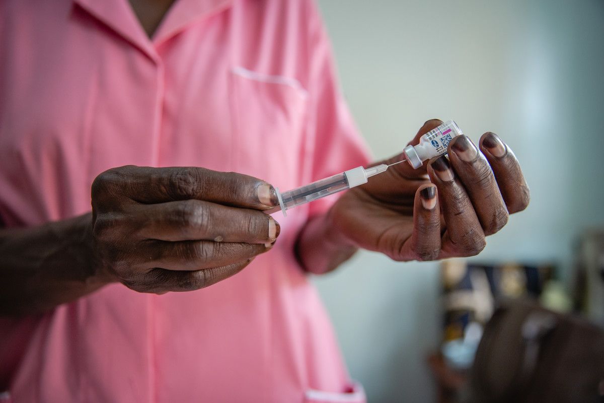 Margaret gives a family planning injection to a client at Kawala Health Center IV in Kampala
